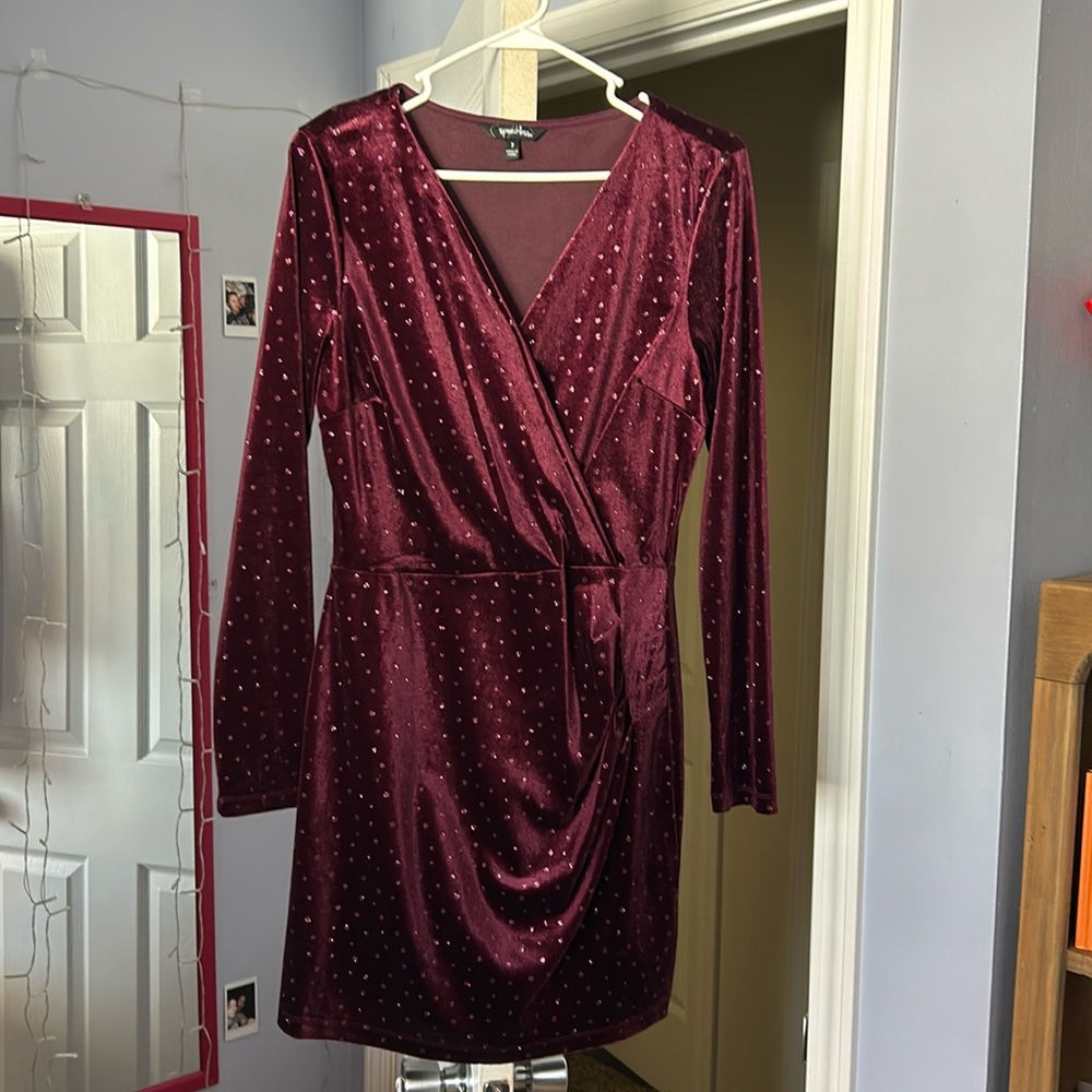 A winter formal dress 
Maroon with pink dots 
Long sleeve dress 
Size 7 juniors